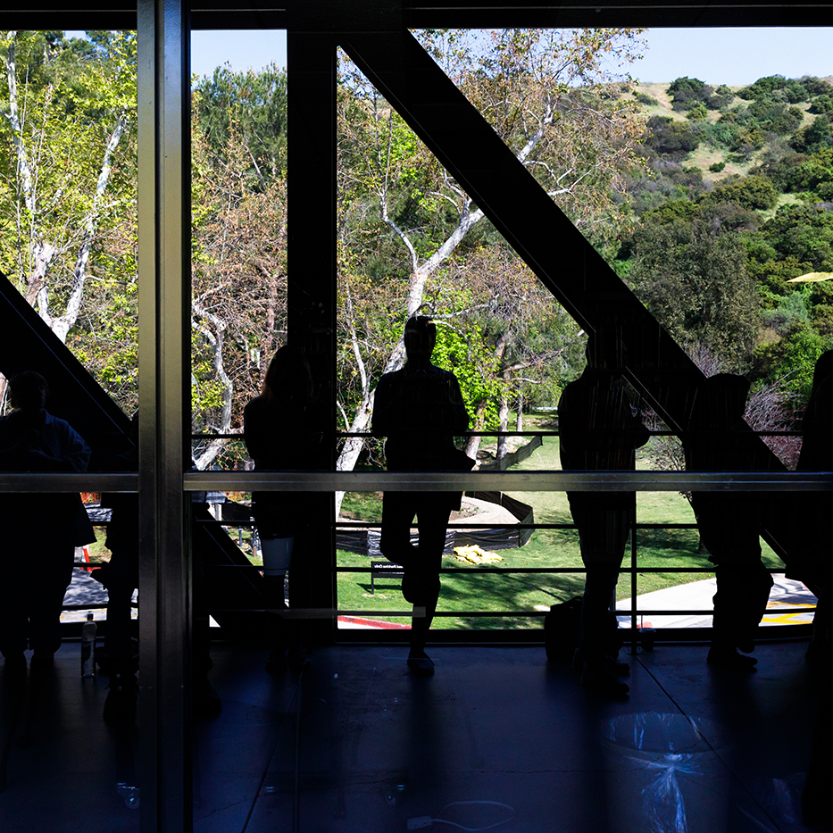 Student silhouettes on bridge