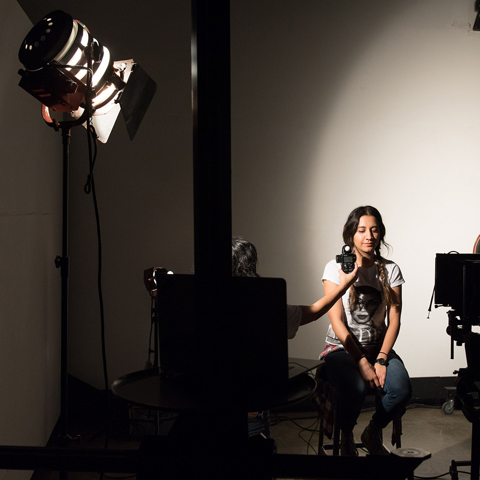 Model being lit for photography